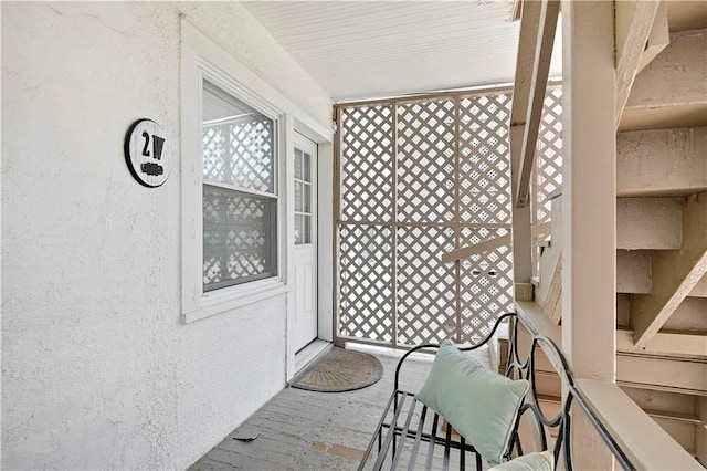 212 Emanuel Cleaver Ii Blvd Unit 2West, Kansas City, MO 64112 - entrance to property featuring stucco siding and covered porch