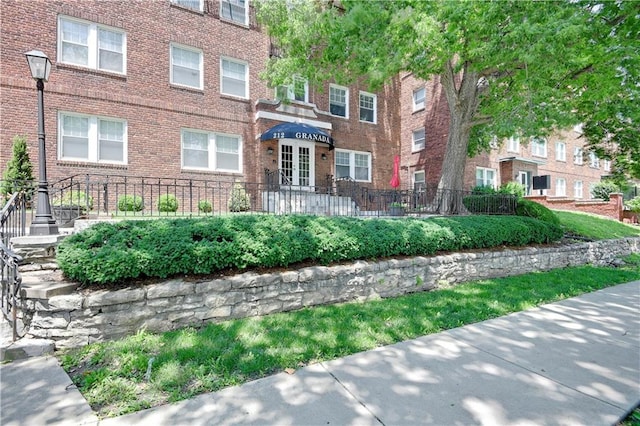 212 Emanuel Cleaver Ii Blvd Unit 2West, Kansas City, MO 64112 - view of front of property with brick siding