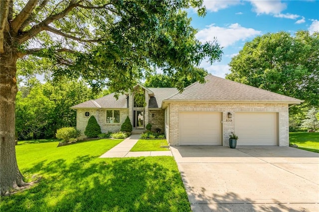 503 Amesbury Dr, Smithville, MO 64089 - view of front facade with an attached garage, brick siding, driveway, a front lawn, and roof with shingles