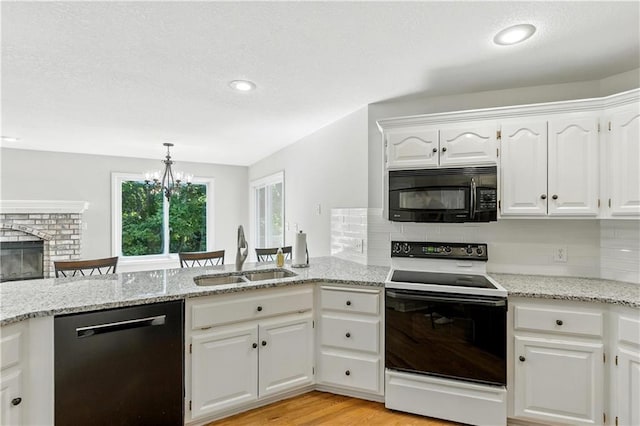 503 Amesbury Dr, Smithville, MO 64089 - kitchen featuring black microwave, white electric range, dishwasher, decorative backsplash, and white cabinets