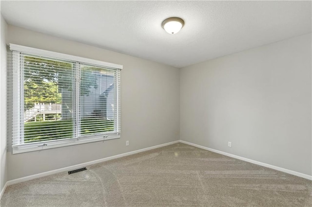 503 Amesbury Dr, Smithville, MO 64089 - carpeted empty room with baseboards