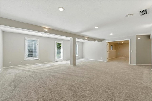 503 Amesbury Dr, Smithville, MO 64089 - basement with light colored carpet and recessed lighting