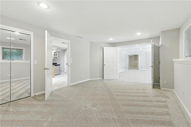 503 Amesbury Dr, Smithville, MO 64089 - hallway with light colored carpet and recessed lighting