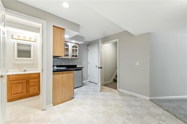 503 Amesbury Dr, Smithville, MO 64089 - kitchen with stainless steel dishwasher, glass insert cabinets, light floors, and recessed lighting