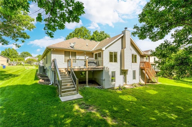 503 Amesbury Dr, Smithville, MO 64089 - back of house featuring stairs, a chimney, a deck, a yard, and roof with shingles