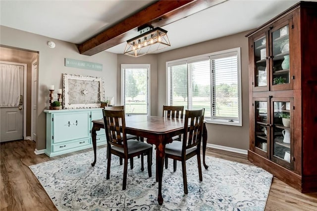 2450 Labette Rd, Ottawa, KS 66067 - dining area with beam ceiling and light wood-type flooring
