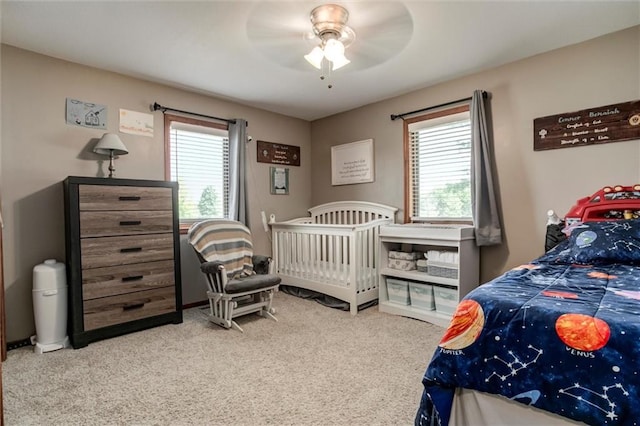 2450 Labette Rd, Ottawa, KS 66067 - carpeted bedroom with multiple windows and a ceiling fan