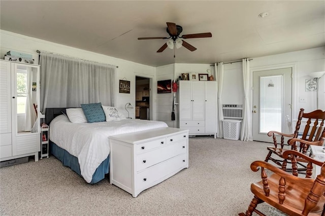 2450 Labette Rd, Ottawa, KS 66067 - bedroom with light carpet, cooling unit, a ceiling fan, and access to outside