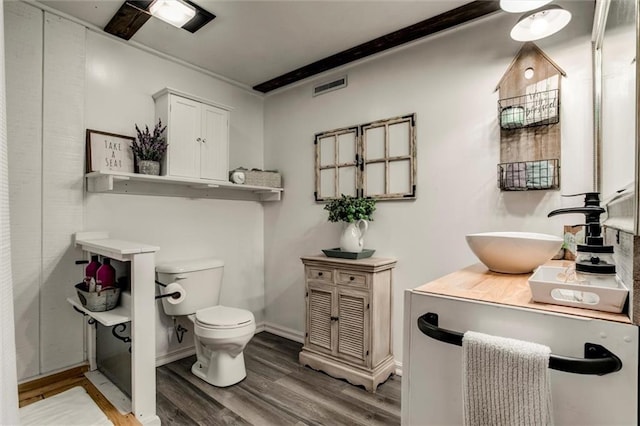2450 Labette Rd, Ottawa, KS 66067 - bathroom featuring wood finished floors and vanity