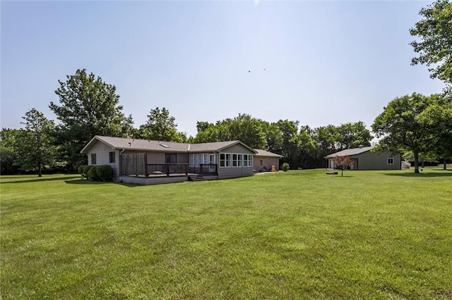 2450 Labette Rd, Ottawa, KS 66067 - view of green lawn with a wooden deck