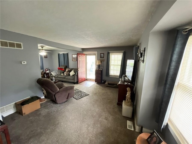 2122 S Scott Ave, Independence, MO 64052 - carpeted living room featuring a ceiling fan