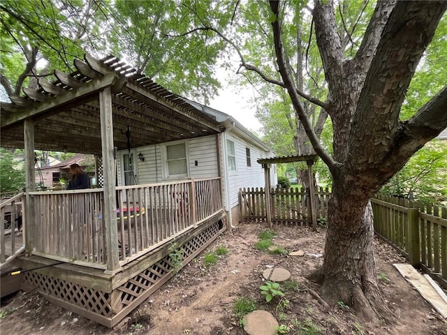 2122 S Scott Ave, Independence, MO 64052 - view of home's exterior featuring a wooden deck and a pergola