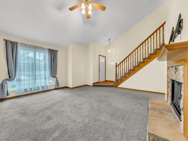 15409 Conser St, Overland Park, KS 66223 - unfurnished living room featuring a fireplace, carpet floors, stairs, ceiling fan, and vaulted ceiling