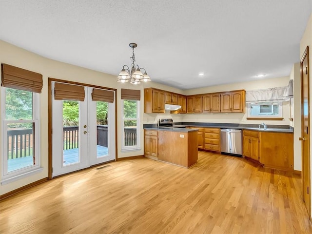 15409 Conser St, Overland Park, KS 66223 - kitchen featuring dishwasher, a peninsula, light wood-style floors, healthy amount of natural light, and recessed lighting