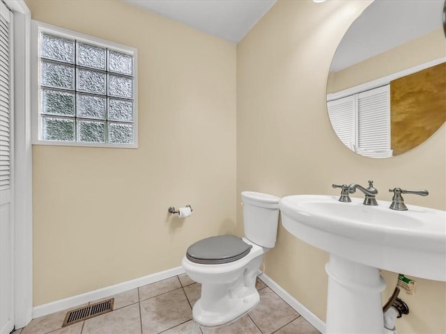 15409 Conser St, Overland Park, KS 66223 - half bathroom featuring tile patterned floors and a closet