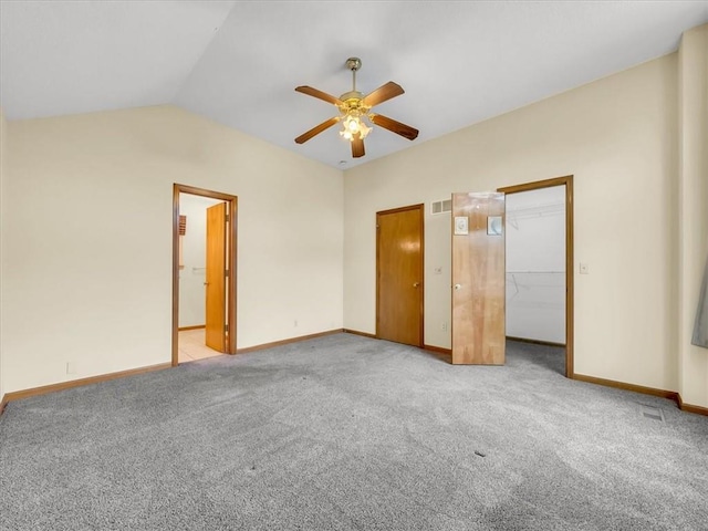 15409 Conser St, Overland Park, KS 66223 - unfurnished bedroom featuring vaulted ceiling, carpet flooring, a walk in closet, and a ceiling fan