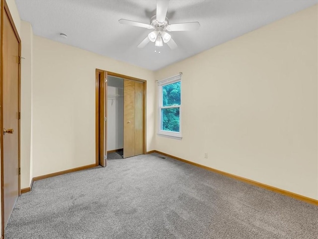 15409 Conser St, Overland Park, KS 66223 - unfurnished bedroom with carpet flooring, a closet, and a ceiling fan