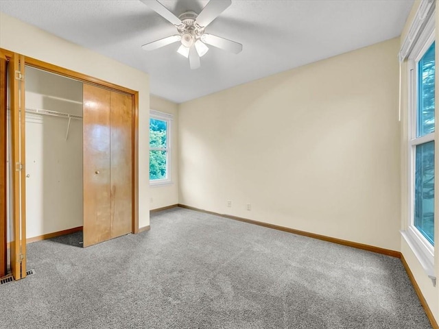 15409 Conser St, Overland Park, KS 66223 - unfurnished bedroom with carpet, multiple windows, and a closet