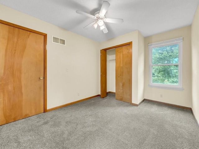 15409 Conser St, Overland Park, KS 66223 - unfurnished bedroom featuring carpet flooring, a ceiling fan, and a closet
