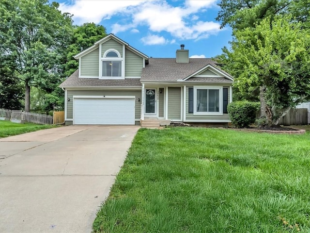 15409 Conser St, Overland Park, KS 66223 - view of front of property with a chimney, roof with shingles, an attached garage, and driveway