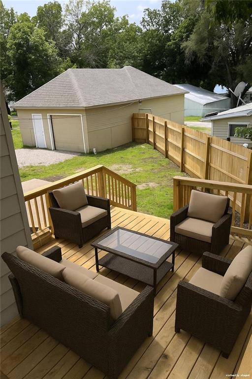 112 N High St, Butler, MO 64730 - deck with an outdoor living space