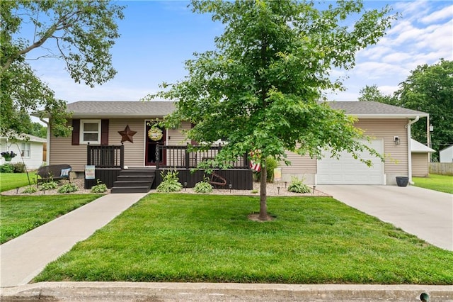505 S Magdalena St, Concordia, MO 64020 - obstructed view of property featuring concrete driveway, a front yard, and a garage