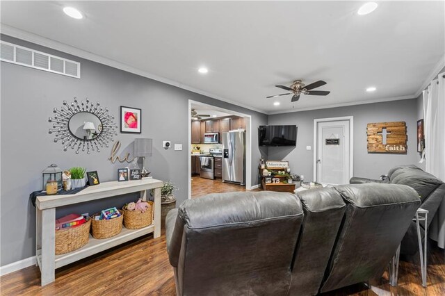 505 S Magdalena St, Concordia, MO 64020 - living area featuring recessed lighting, a ceiling fan, ornamental molding, and wood finished floors