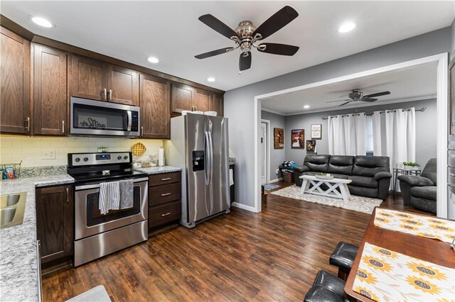 505 S Magdalena St, Concordia, MO 64020 - kitchen featuring stainless steel appliances, ceiling fan, dark brown cabinetry, dark wood-style floors, and recessed lighting
