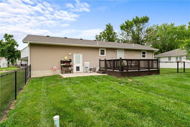 505 S Magdalena St, Concordia, MO 64020 - back of house with a fenced backyard, a deck, and a patio area