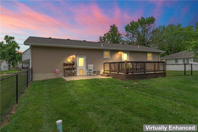 505 S Magdalena St, Concordia, MO 64020 - back of property featuring a fenced backyard, a wooden deck, and a patio area