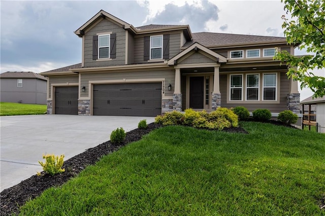 11704 N Laurel Ave, Kansas City, MO 64157 - craftsman house featuring a front lawn, a garage, concrete driveway, and stone siding