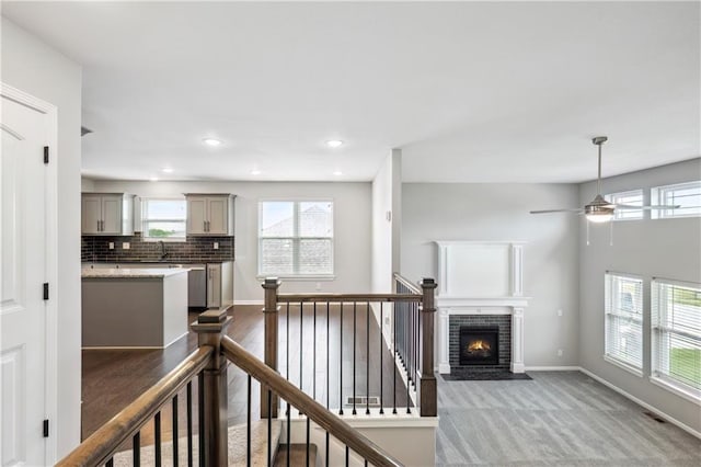 11704 N Laurel Ave, Kansas City, MO 64157 - corridor featuring an upstairs landing, dark carpet, and recessed lighting