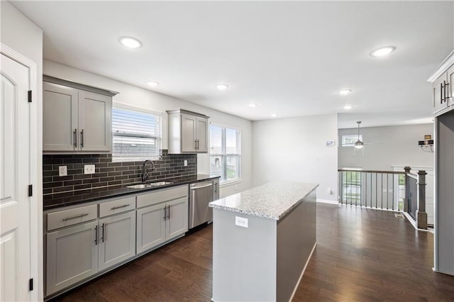 11704 N Laurel Ave, Kansas City, MO 64157 - kitchen featuring dishwasher, ceiling fan, dark wood-type flooring, gray cabinets, and recessed lighting