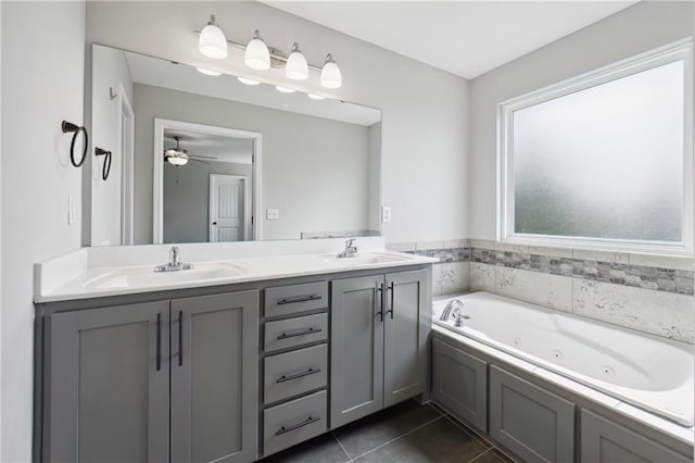 11704 N Laurel Ave, Kansas City, MO 64157 - full bathroom featuring double vanity, a jetted tub, tile patterned floors, and ceiling fan