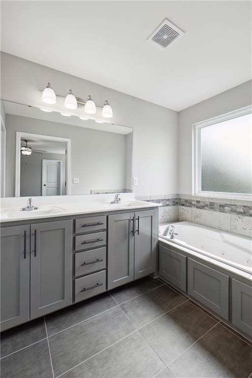 11704 N Laurel Ave, Kansas City, MO 64157 - bathroom with tile patterned flooring, double vanity, and a jetted tub