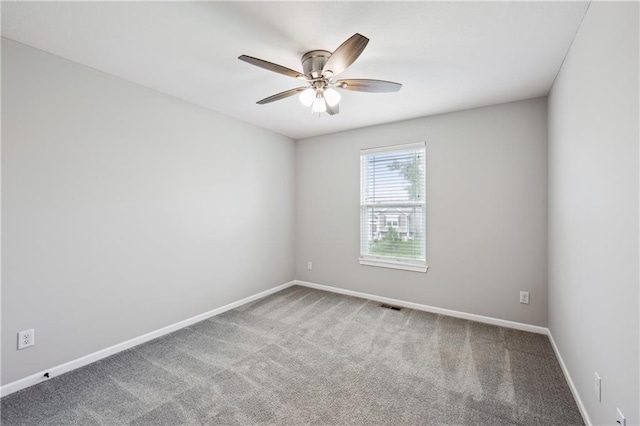 11704 N Laurel Ave, Kansas City, MO 64157 - carpeted spare room with ceiling fan and baseboards
