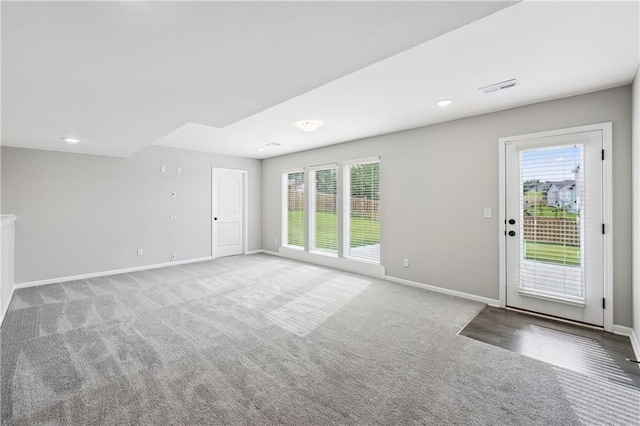 11704 N Laurel Ave, Kansas City, MO 64157 - unfurnished living room with healthy amount of natural light and carpet