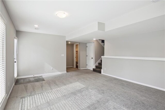 11704 N Laurel Ave, Kansas City, MO 64157 - unfurnished room with stairway, carpet, and recessed lighting