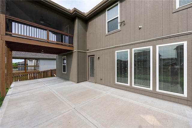 11704 N Laurel Ave, Kansas City, MO 64157 - back of property featuring a patio and a ceiling fan
