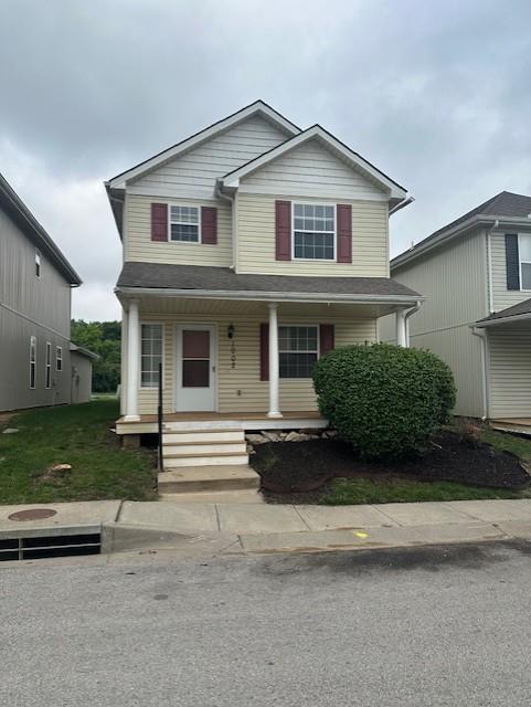 1002 NE Deer Creek Rd, Grain Valley, MO 64029 - view of front of house featuring covered porch