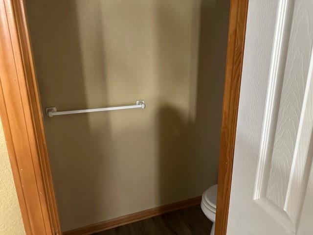 1002 NE Deer Creek Rd, Grain Valley, MO 64029 - bathroom featuring toilet and baseboards