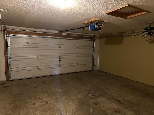 1002 NE Deer Creek Rd, Grain Valley, MO 64029 - garage with a garage door opener
