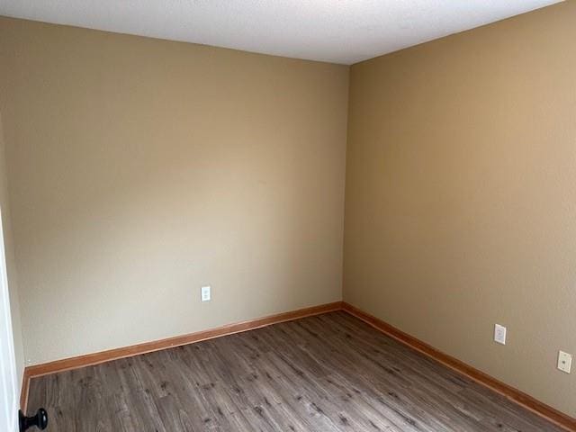1002 NE Deer Creek Rd, Grain Valley, MO 64029 - unfurnished room featuring wood finished floors