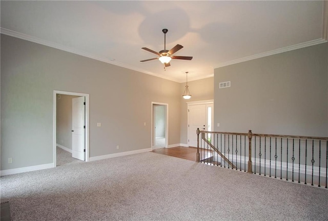 3718 NE 90th Ter, Kansas City, MO 64156 - empty room featuring carpet floors, a ceiling fan, and ornamental molding