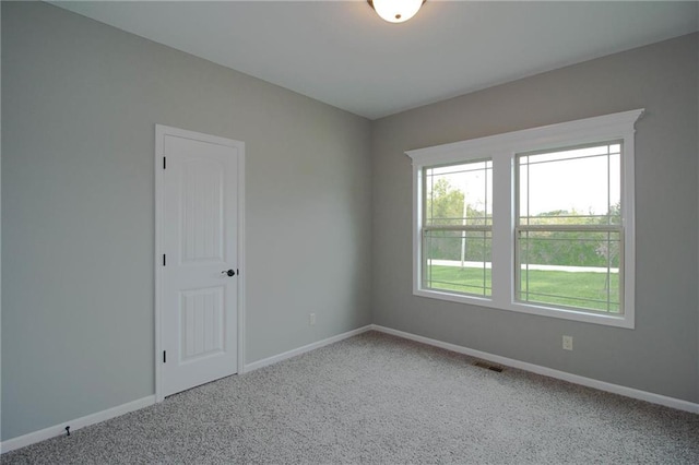 3718 NE 90th Ter, Kansas City, MO 64156 - carpeted spare room with baseboards