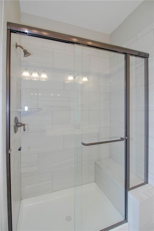3718 NE 90th Ter, Kansas City, MO 64156 - bathroom with a stall shower