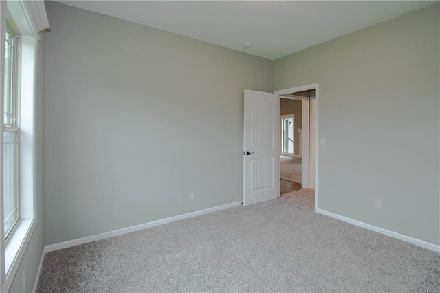 3718 NE 90th Ter, Kansas City, MO 64156 - carpeted empty room featuring baseboards