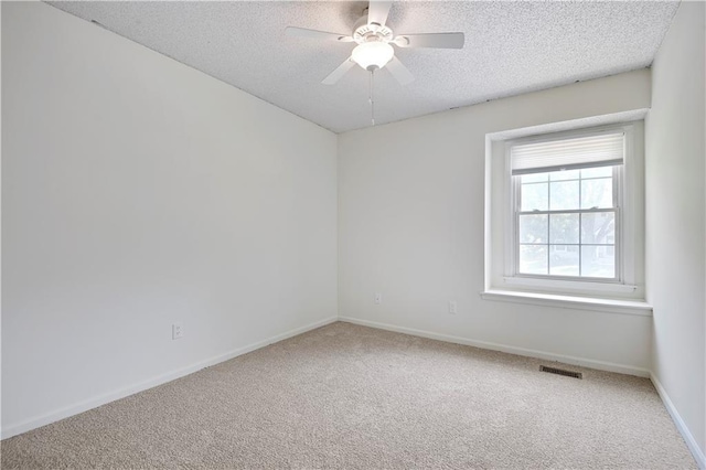 819 N Arroyo Dr, Olathe, KS 66061 - carpeted empty room with a textured ceiling and a ceiling fan