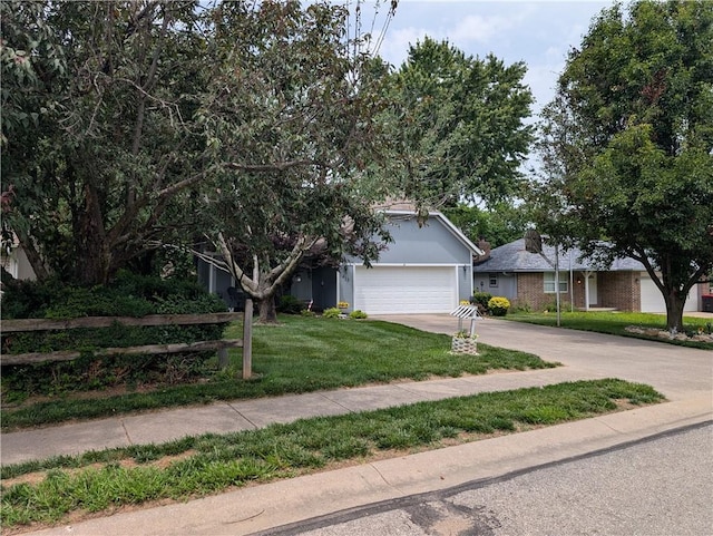 413 Quail Trl, Warrensburg, MO 64093 - view of front of home with driveway, an attached garage, and a front yard