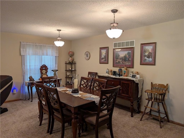 413 Quail Trl, Warrensburg, MO 64093 - dining space featuring light carpet and a textured ceiling